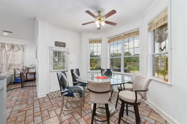 a dining room with furniture and window