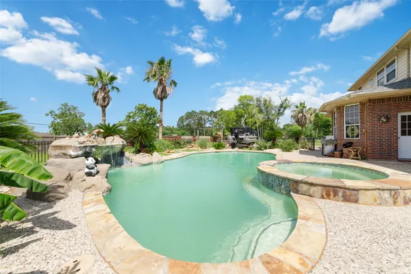 a view of a swimming pool with a patio
