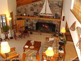 6768 Lakeshore Road Palms, MI 48465 - Photo 9 of 19 GREAT ROOM WITH STONE FIREPLACE