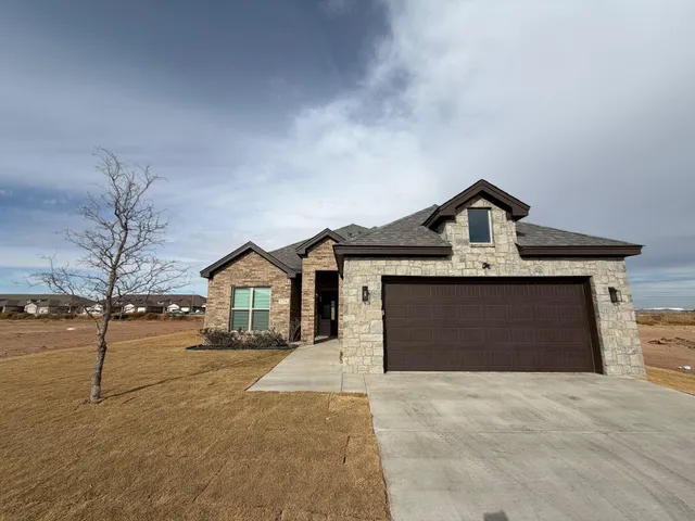 a view of front of house with a yard