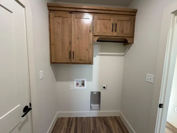 a view of storage and utility room with racks on the wall