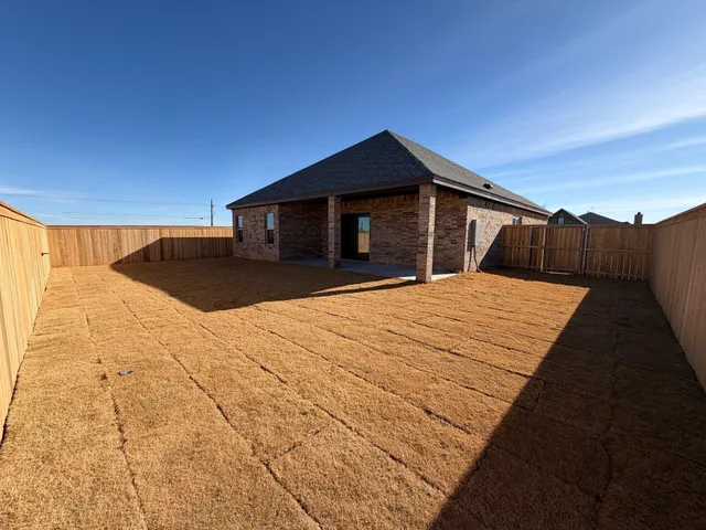 a view of a backyard of the house