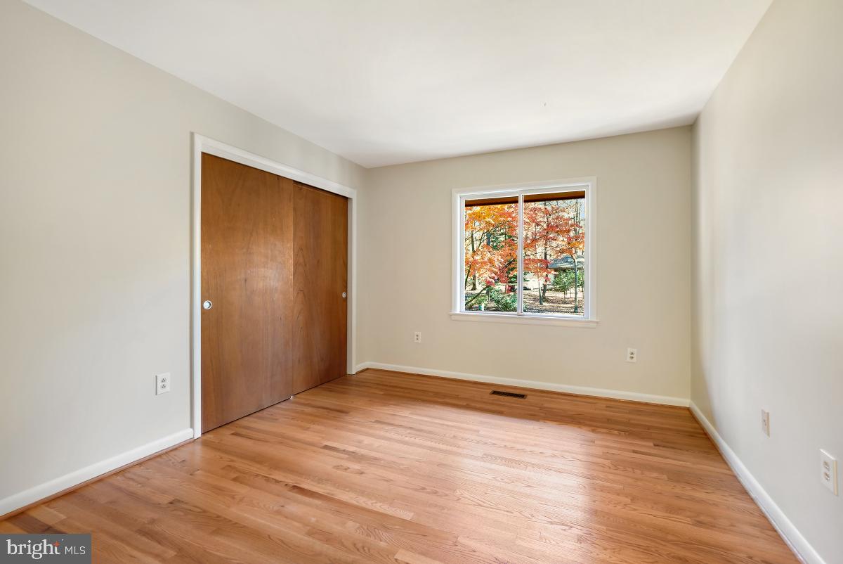 2606 Deerdell Lane Reston, VA 20191 - Photo 40 of 49 an empty room with wooden floor and windows
