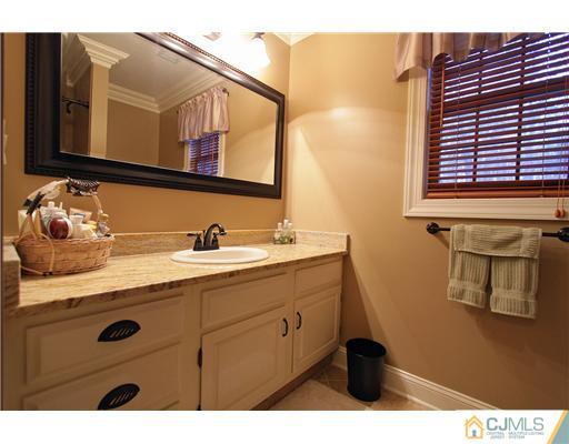 32 South Rhoda Street Monroe Township, NJ 08831 - Photo 16 of 20 a bathroom with a sink and a mirror