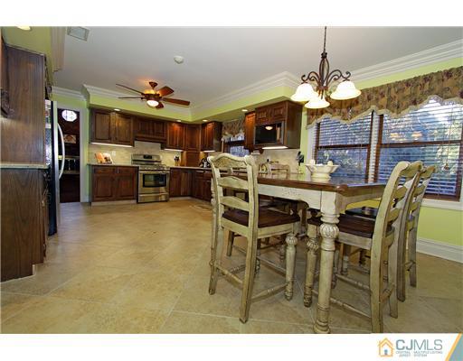 32 South Rhoda Street Monroe Township, NJ 08831 - Photo 9 of 20 a view of a dining room with furniture and chandelier