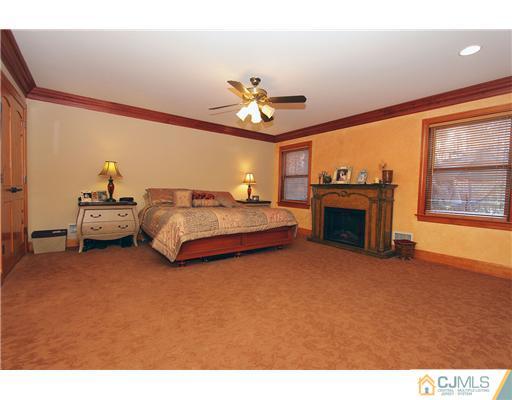 32 South Rhoda Street Monroe Township, NJ 08831 - Photo 10 of 20 a living room with furniture a fireplace and a flat screen tv