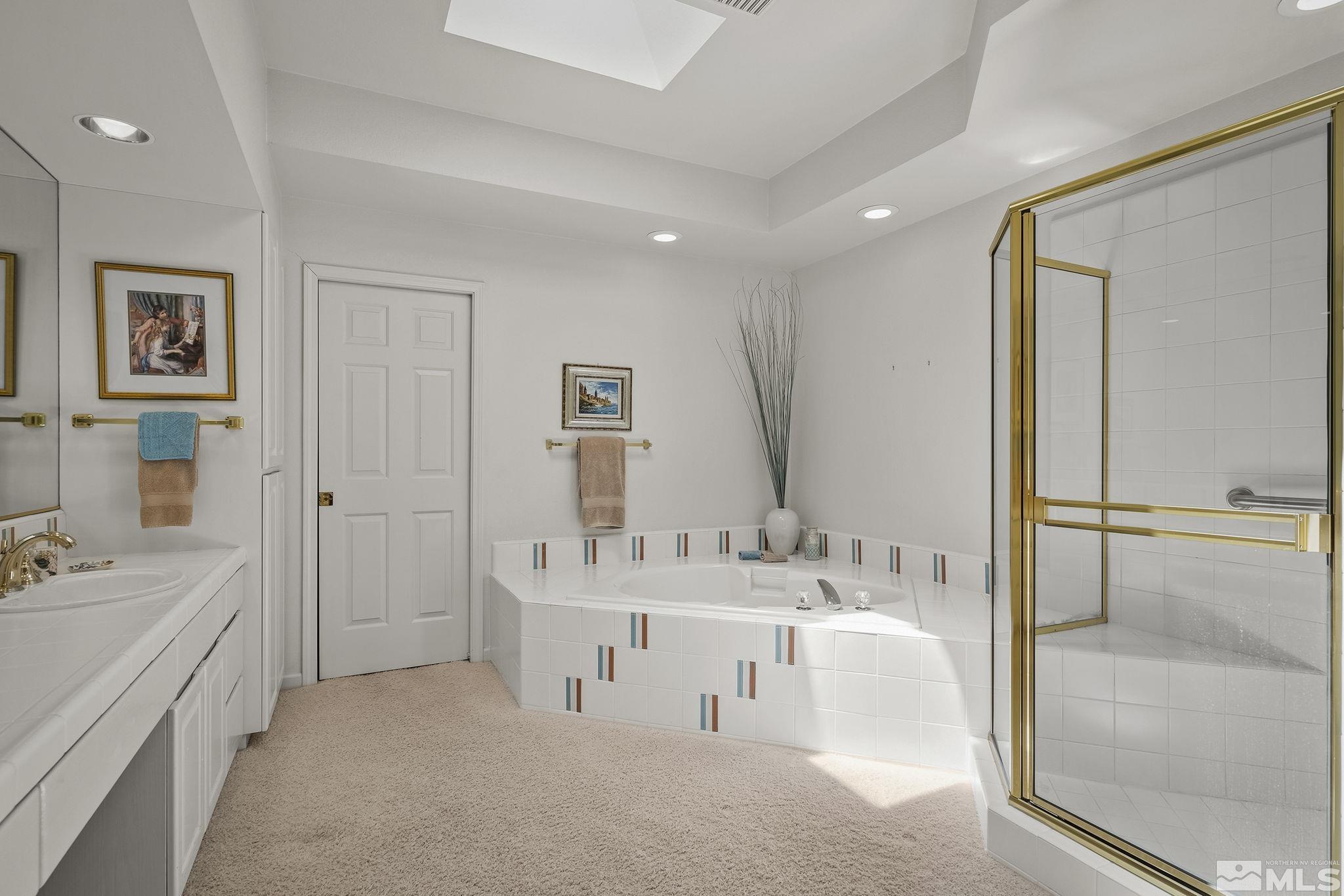 3835 Chinook Creek Road Reno, NV 89519 - Photo 15 of 29 a bathroom with a double vanity sink mirror and bathtub