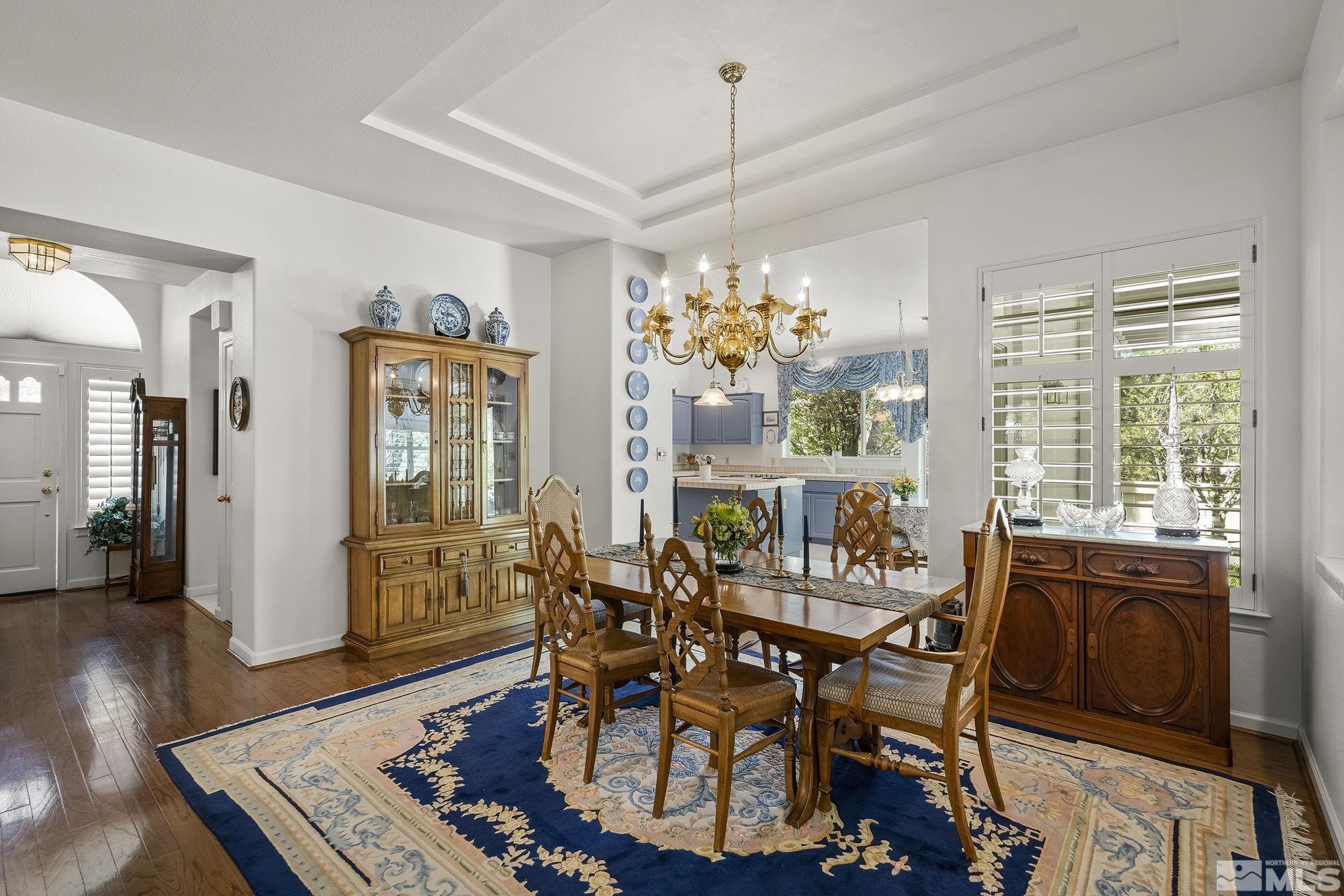 3835 Chinook Creek Road Reno, NV 89519 - Photo 5 of 29 a view of a dining room with furniture a chandelier and wooden floor