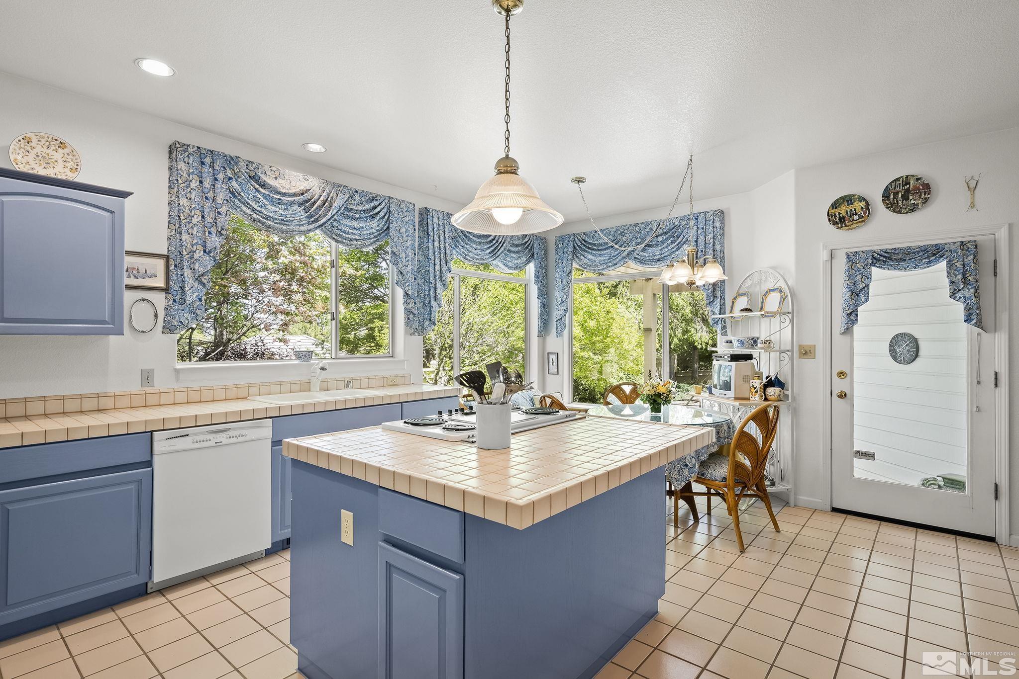 3835 Chinook Creek Road Reno, NV 89519 - Photo 7 of 29 a kitchen with a sink stove and cabinets