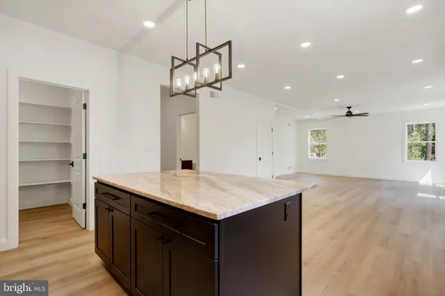 a kitchen with a table and chairs
