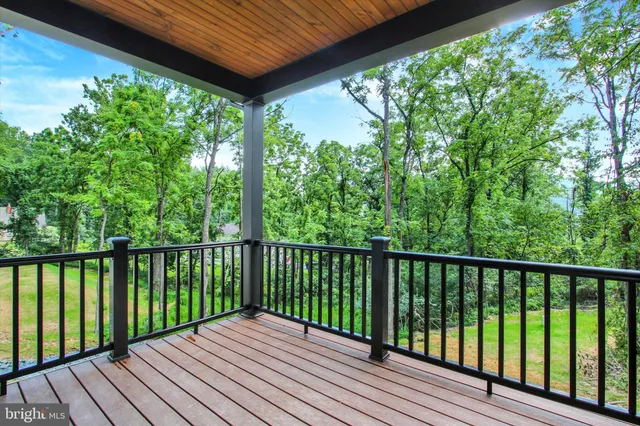 a view of balcony with wooden floor