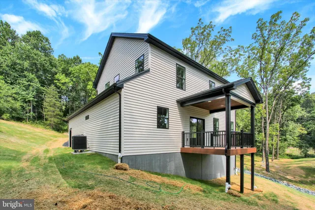 a backyard of a house with seating space