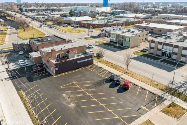 an aerial view of residential building with parking space