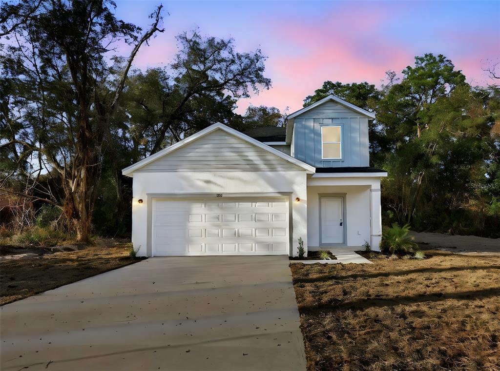 808 Campello Street Altamonte Springs, FL 32701 - Photo 1 of 1 a front view of a house with a yard and garage