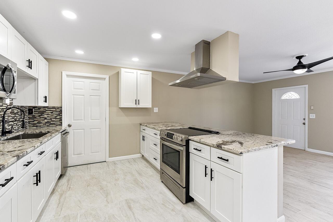 a kitchen with a stove and a sink
