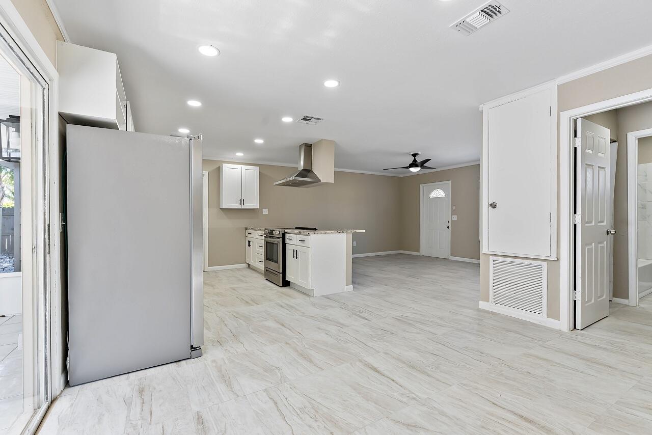 111 Alameda Avenue Sebastian, FL 32958 - Photo 14 of 33 a view of a kitchen with a refrigerator and a sink