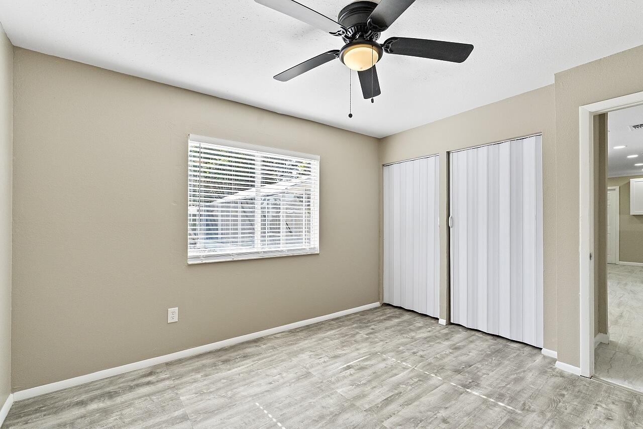 111 Alameda Avenue Sebastian, FL 32958 - Photo 22 of 33 a view of an empty room with chandelier fan and a window