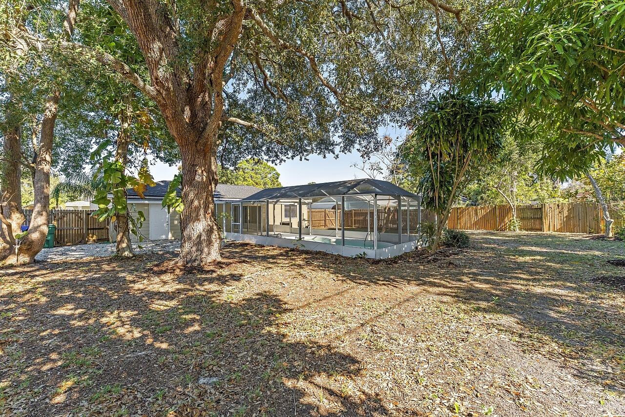 111 Alameda Avenue Sebastian, FL 32958 - Photo 26 of 33 a view of a yard in front of a house with large trees