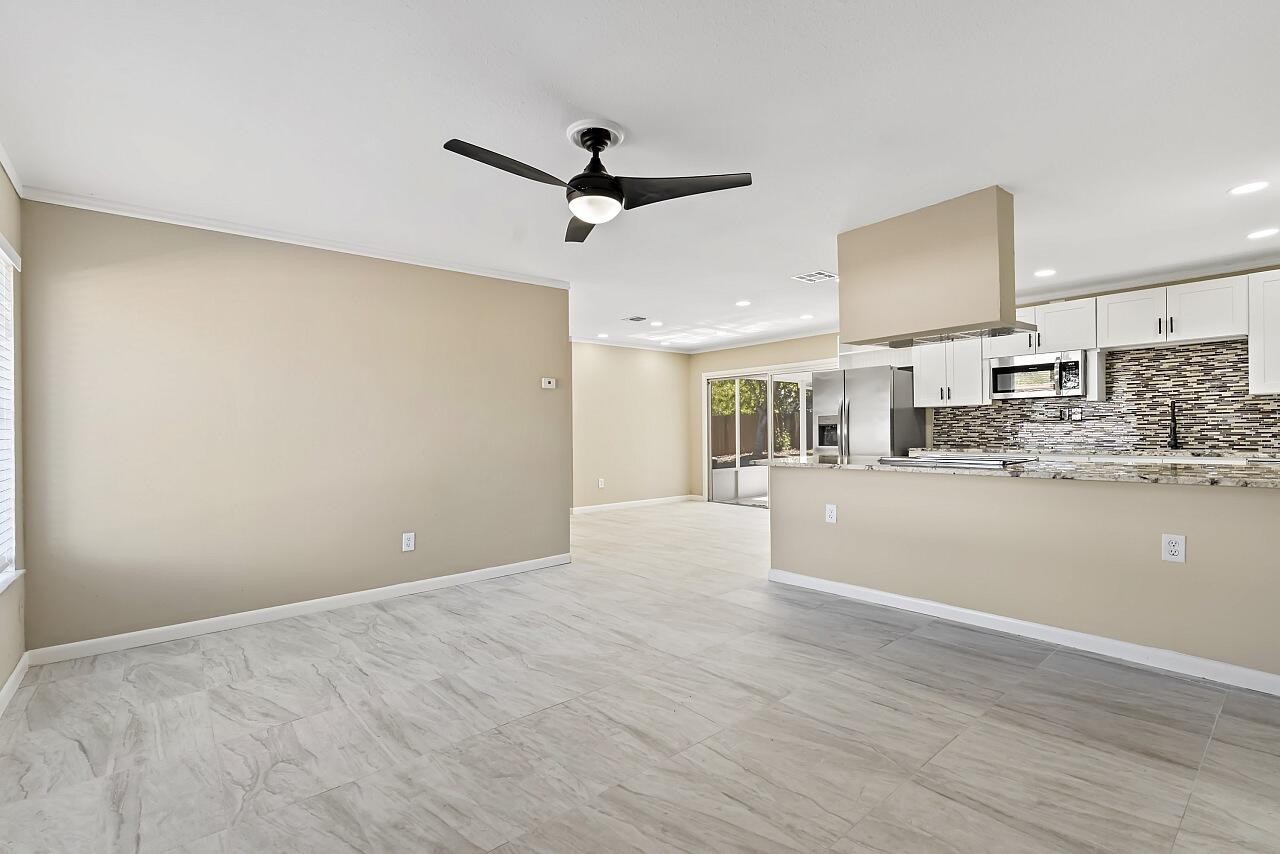 111 Alameda Avenue Sebastian, FL 32958 - Photo 5 of 33 a view of kitchen and livingroom with wooden floor