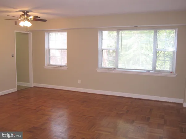 a view of an empty room with a window