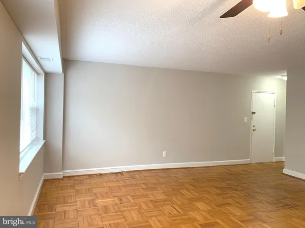 a view of an empty room and window