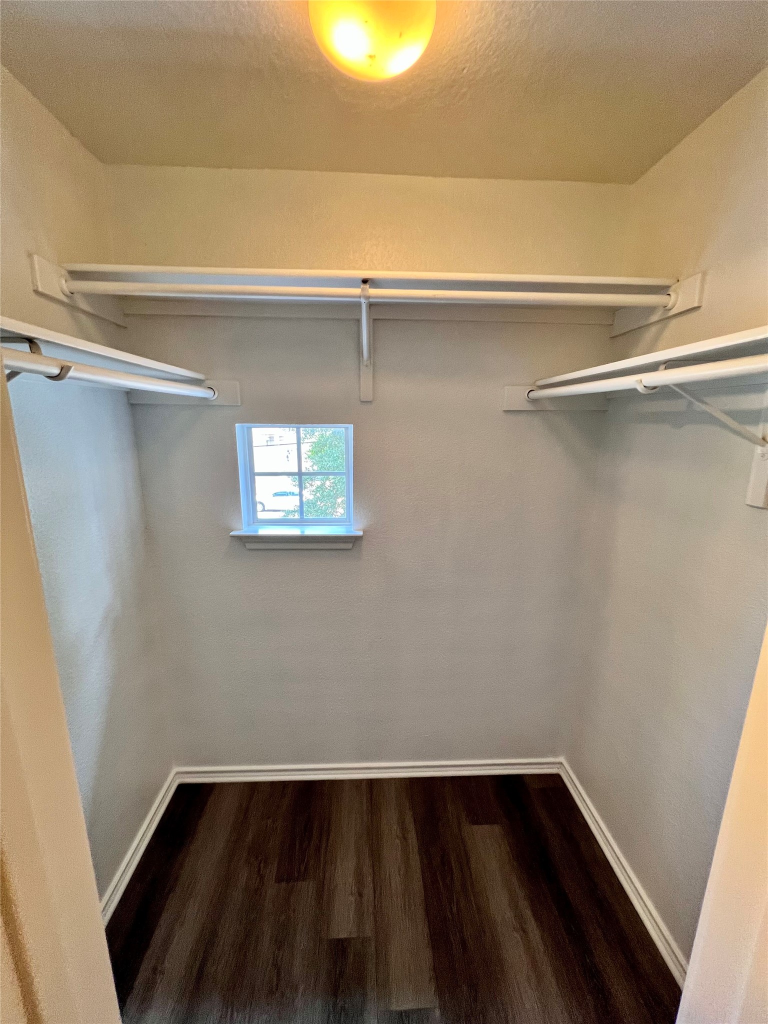 1801 Constantino Circle Austin, TX 78745 - Photo 15 of 22 a view of an empty room with wooden floor and a window
