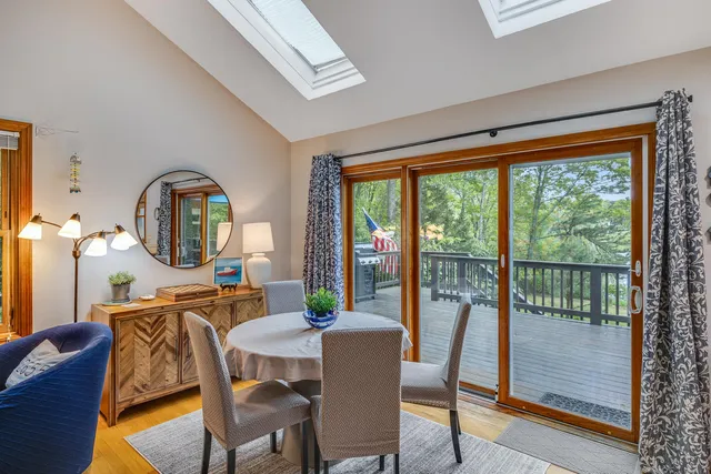 a bedroom with two beds and a large window