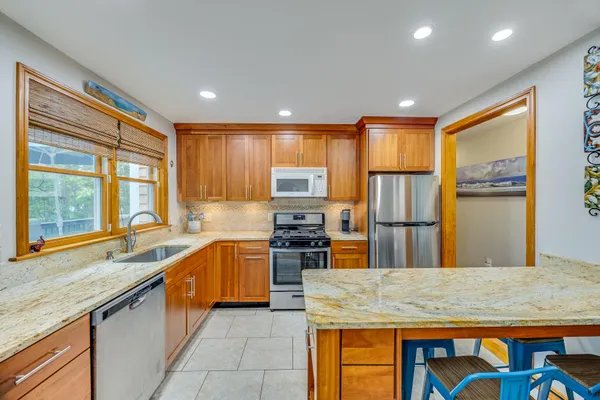 a bedroom with a large bed and a large window