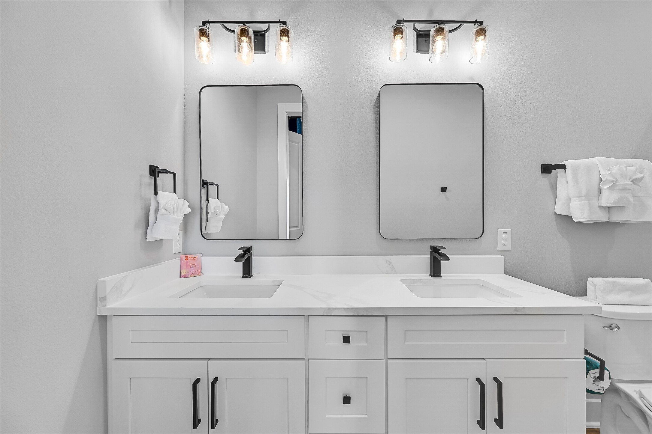 16728 West Beach Road Jamaica Beach, TX 77554 - Photo 35 of 46 The en-suite bathroom features double sinks and a shower.