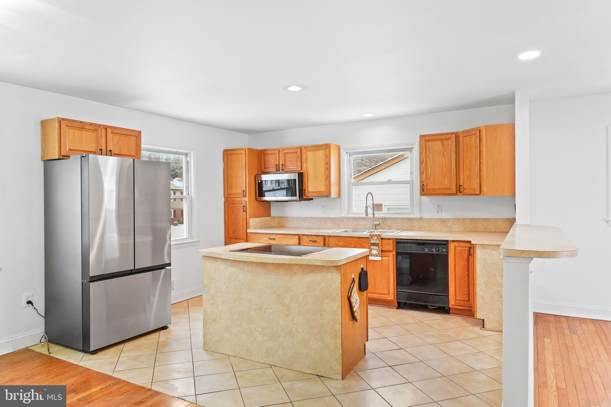 6903 Fawncrest Drive Capitol Heights, MD 20743 - Photo 17 of 36 a kitchen with stainless steel appliances granite countertop a refrigerator sink and stove