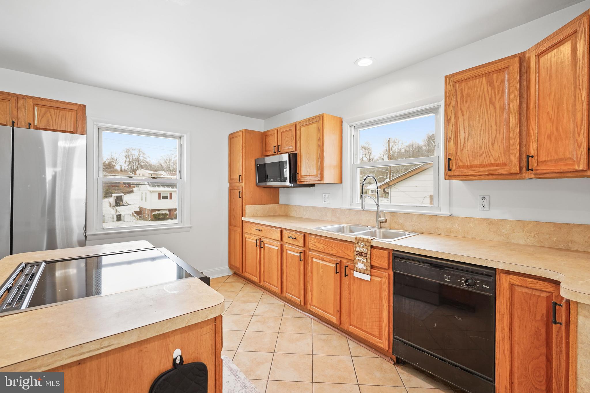 6903 Fawncrest Drive Capitol Heights, MD 20743 - Photo 21 of 36 a kitchen with stainless steel appliances granite countertop a sink stove and refrigerator