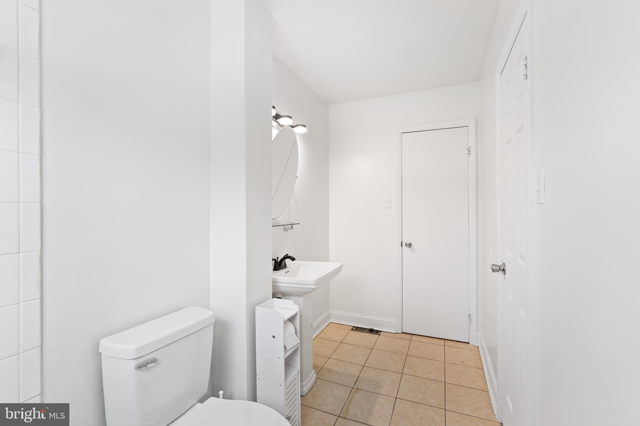 6903 Fawncrest Drive Capitol Heights, MD 20743 - Photo 32 of 36 a bathroom with a toilet and a shower