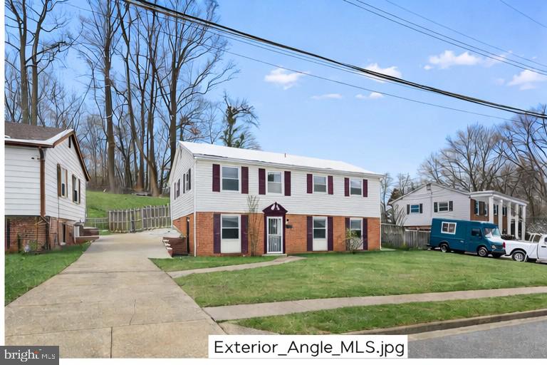 6903 Fawncrest Drive Capitol Heights, MD 20743 - Photo 34 of 36 a front view of a house with a yard