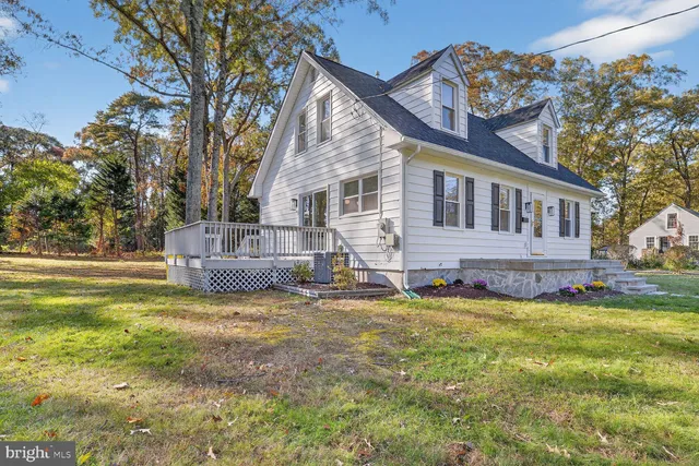 a house view with a sitting space and garden