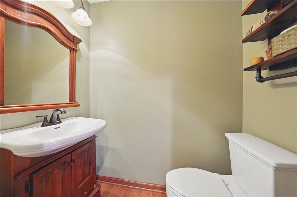 1751 Hassam Road Coraopolis, PA 15108 - Photo 26 of 50 a bathroom with a sink a toilet and mirror
