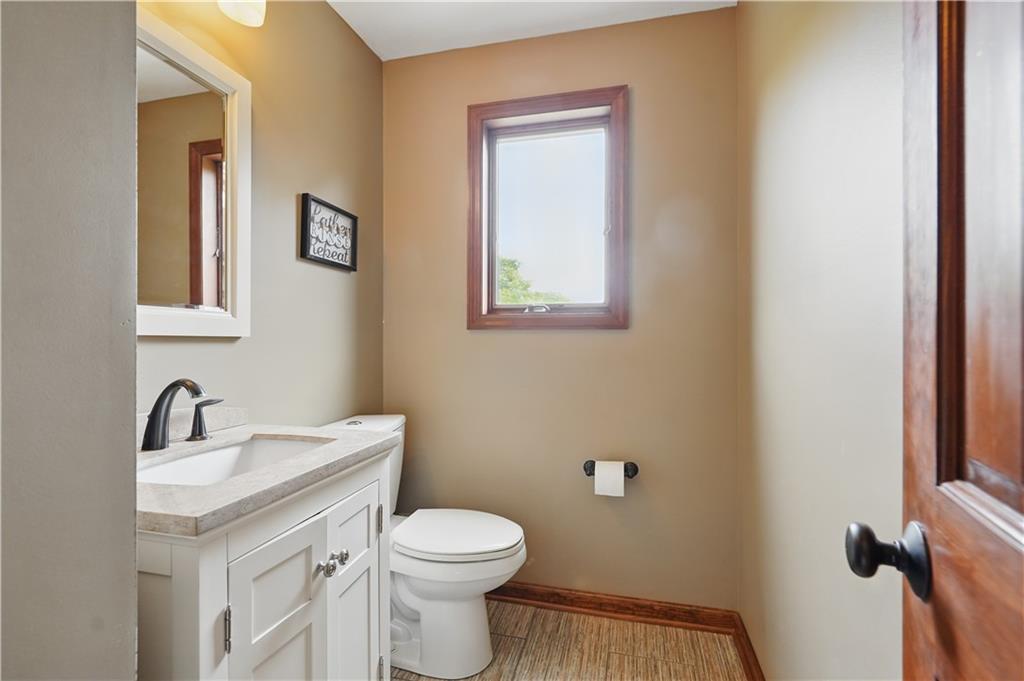 1751 Hassam Road Coraopolis, PA 15108 - Photo 28 of 50 a bathroom with a toilet a sink a mirror and vanity