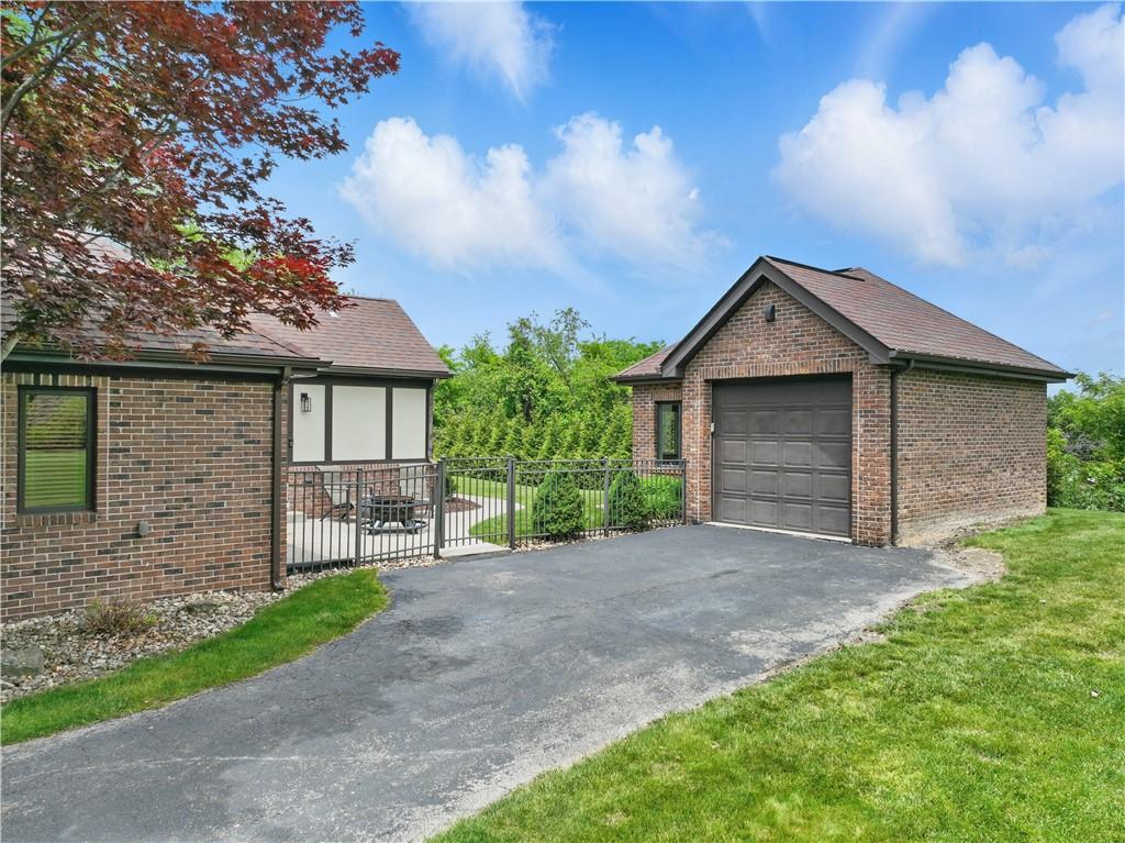 1751 Hassam Road Coraopolis, PA 15108 - Photo 3 of 50 a front view of a house with a garden and yard