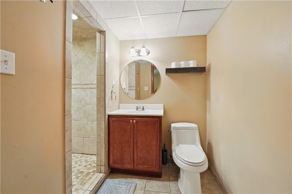 1751 Hassam Road Coraopolis, PA 15108 - Photo 45 of 50 a bathroom with a toilet sink and mirror