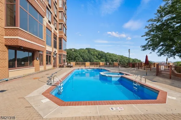 a view of a swimming pool with lounge chair