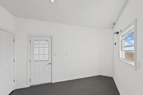 an empty room with windows