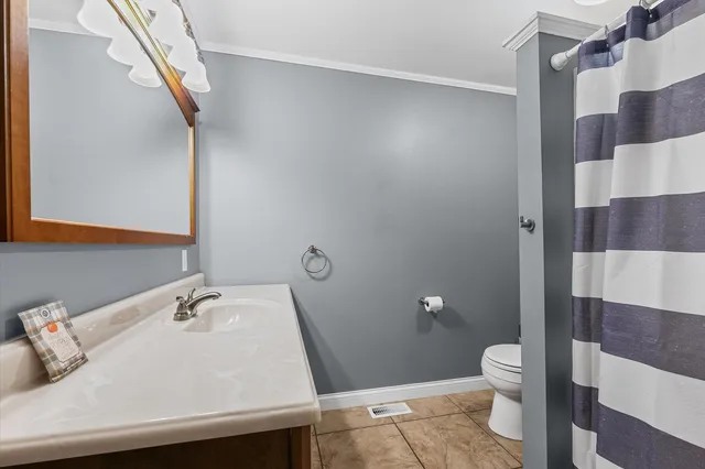 a bathroom with a sink and toilet