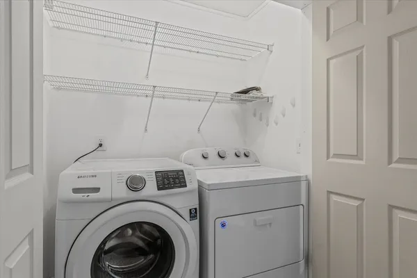 a utility room with dryer and washer