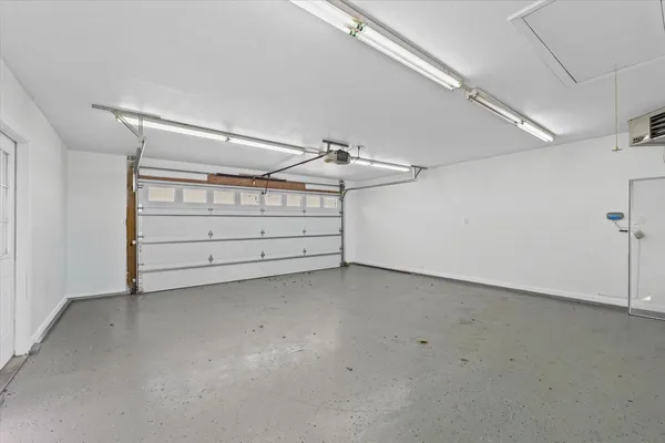 a view of a backyard with a tree