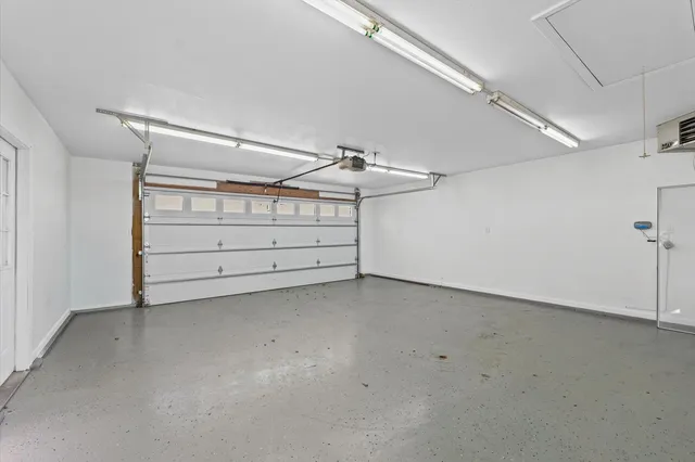 a view of a backyard with a tree