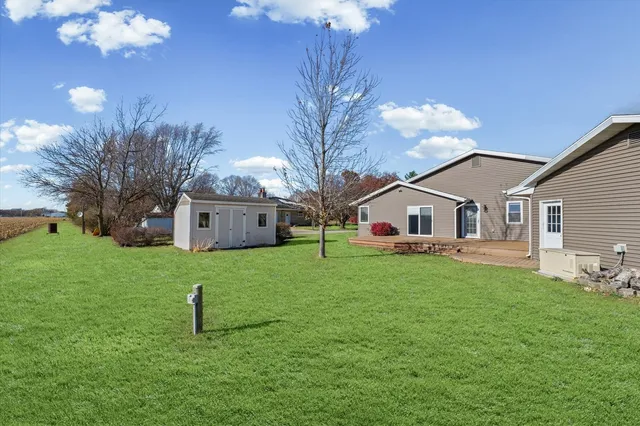 a front view of house with yard and tree s