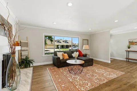 a living room with furniture and a rug