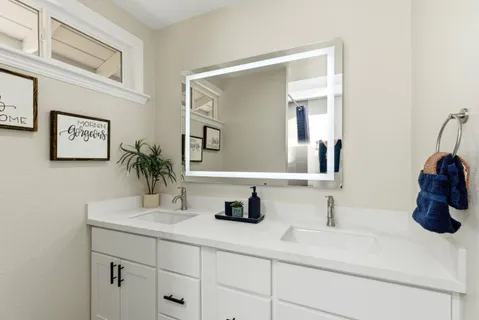 a bathroom with a sink and a mirror