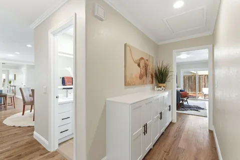 a spacious bathroom with a double vanity sink and a mirror
