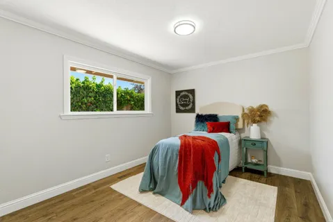a room with a bed and a window