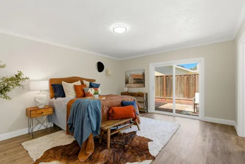 a bedroom with furniture and a window